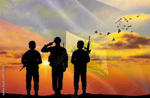 Silhouette of a soldier with a background of the Haiti flag and a sunset or sunrise. Concept of national holidays. Commemoration Day. photo