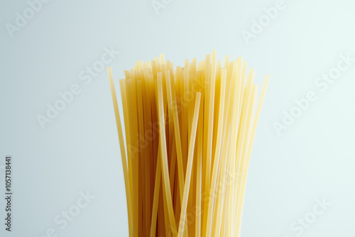 Twirled Italian Pasta Coils on Stainless Steel Surface