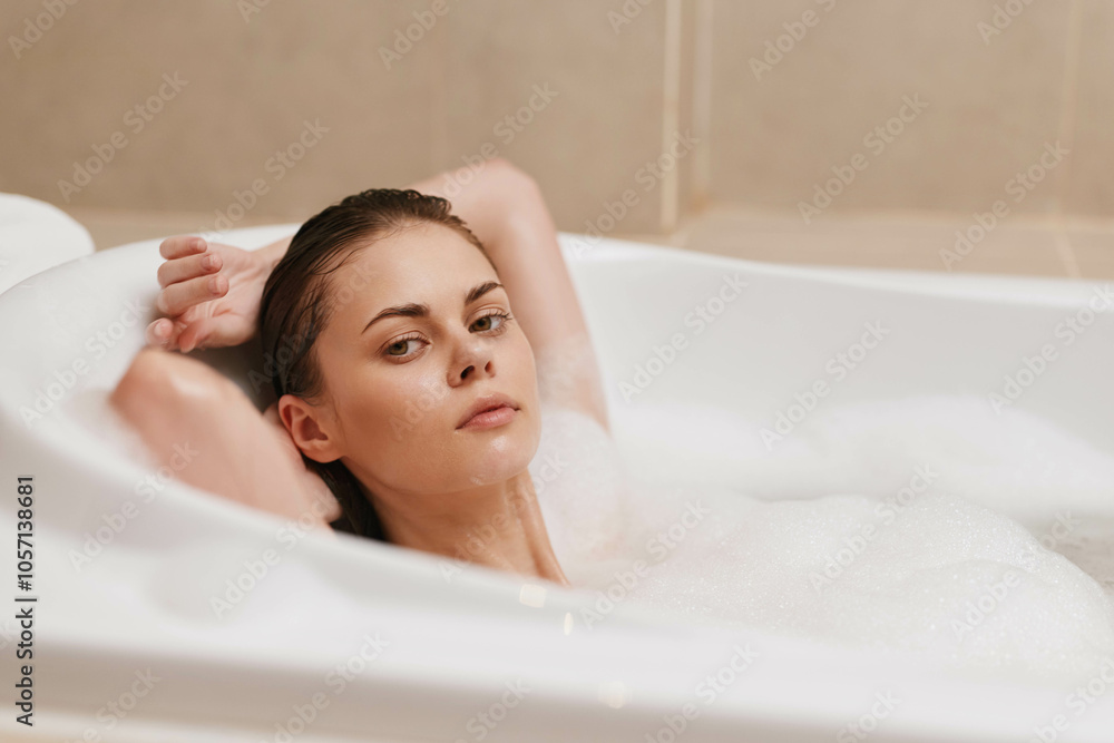 Relaxed young woman enjoying a bubble bath, leaning back in a tub with a serene expression, surrounded by calming atmosphere and soft lighting. Relaxed young woman enjoying a bubble bath, leaning back in a tub with a serene expression, surrounded by calming atmosphere and soft lighting.