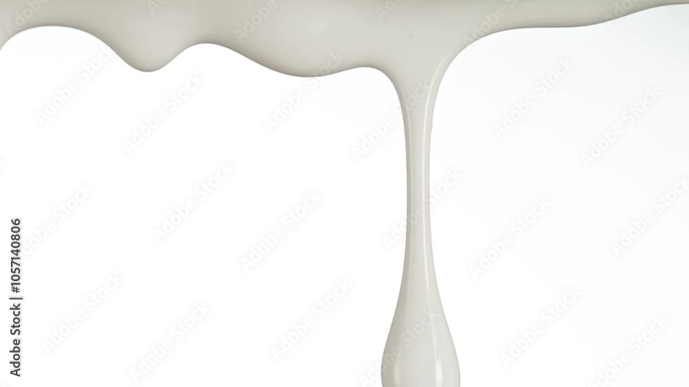 Super Slow Motion Detail Shot of Slowly Dripping Fresh Cream Isolated on White at 1000fps. Super Slow Motion Detail Shot of Slowly Dripping Fresh Cream Isolated on White at 1000fps.