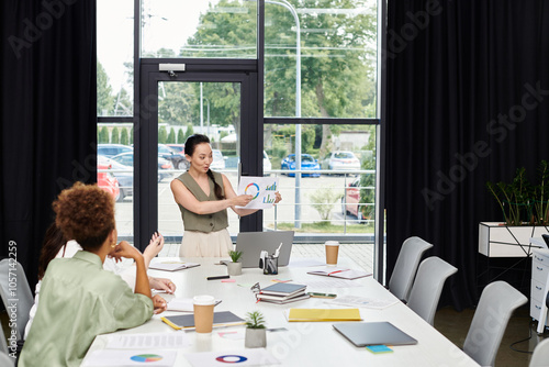 A skilled professional presents insightful data to colleagues in a contemporary office setting.