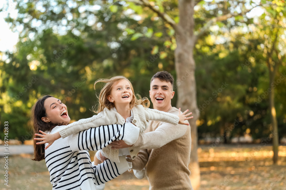 Happy family having fun together in beautiful autumn park Happy family having fun together in beautiful autumn park