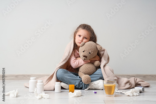 Sick little girl with sore ...