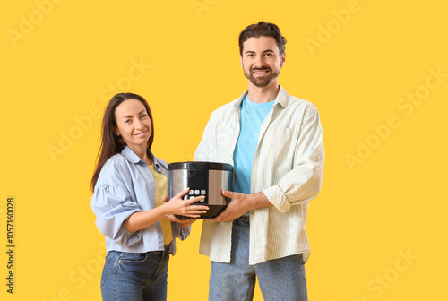 Happy couple holding modern...