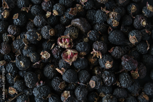 Dried Black Scotch Briar or Black Hips with red seeds as pomegranate. Dried fruits. Rosa spinosissima, altaica. Superfood, Strong antioxidant.