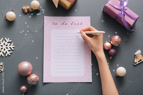 Woman writing to-do list wi...