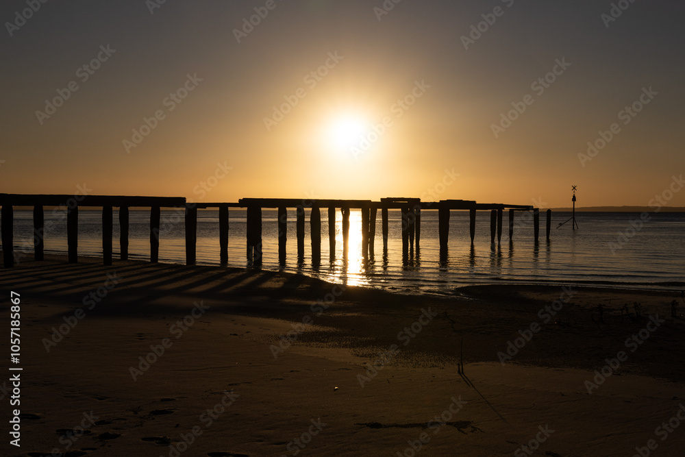 McKenzie jetty pier, sunset over ocean, K'gari, Fraser Island, Queensland Australia, tourism travel tourist destination McKenzie jetty pier, sunset over ocean, K'gari, Fraser Island, Queensland Australia, tourism travel tourist destination