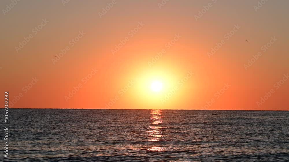 Beautiful sunset over the ocean, featuring a glowing orange sky and calm water, capturing a peaceful and warm evening atmosphere.
Beautiful sunset over the ocean, featuring a glowing orange sky and calm water, capturing a peaceful and warm evening atmosphere.
