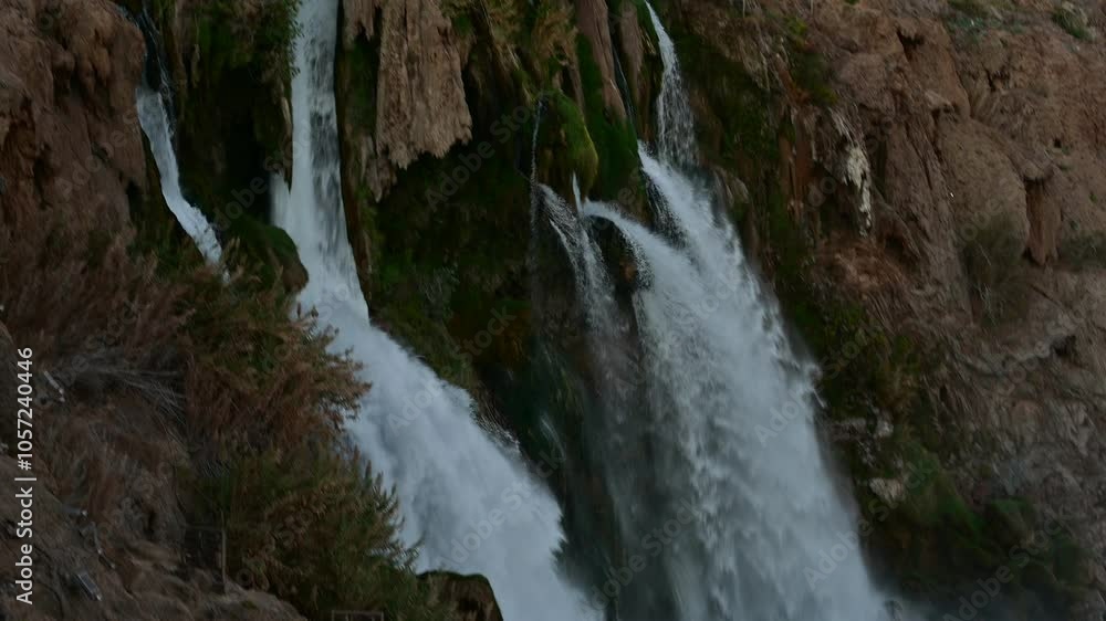 Scenic view of Duden Waterfall cascading into a lush forested area near Antalya, Turkey, creating a serene and picturesque natural setting.
Scenic view of Duden Waterfall cascading into a lush forested area near Antalya, Turkey, creating a serene and picturesque natural setting.