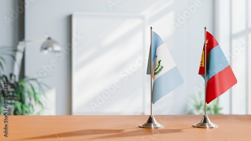 FLAGS OF GUATEMALA AND MONGOLIA ON TABLE photo