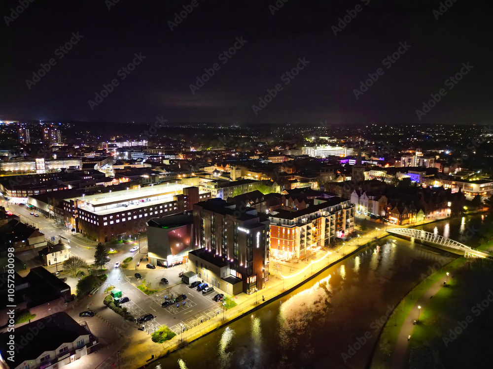 Obraz premium Illuminated Central Bedford City of England United Kingdom During Night. April 5th, 2024, High Angle Footage Was Captured after Sunset and Beginning of Night with Drone's Camera