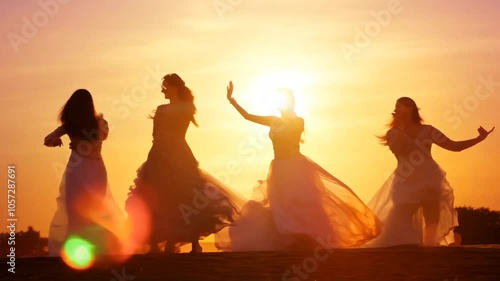 Blurred sunset motion people Group dancing slow active bar-b-q beach balefire camp campfire celebrate celebration crowd silhouette dusk fire water friends friendship fun holiday leisure nature ocean 