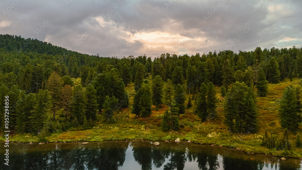 the lake is Bright at sunset, filmed from a drone the lake is Bright at sunset, filmed from a drone