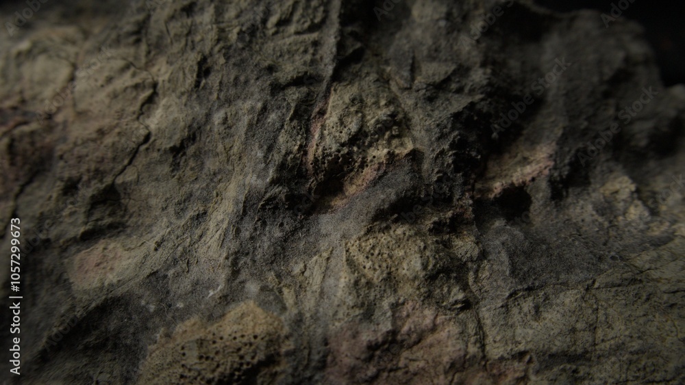 Rough textured dark rock with weathered surface Rough textured dark rock with weathered surface