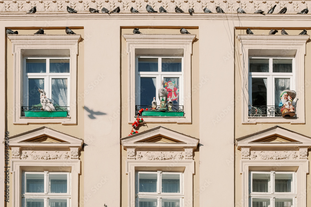 Fototapeta premium Santa Claus climbing on a balcony