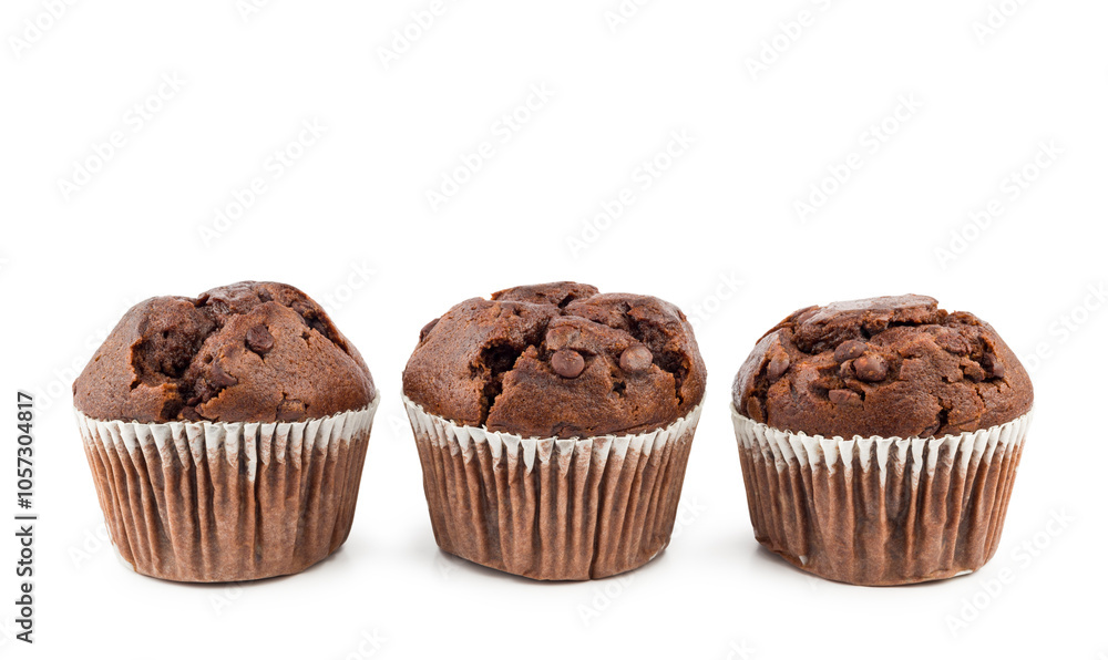 Chocolate chip muffins in a row on white background. Chocolate chip muffins in a row on white background.