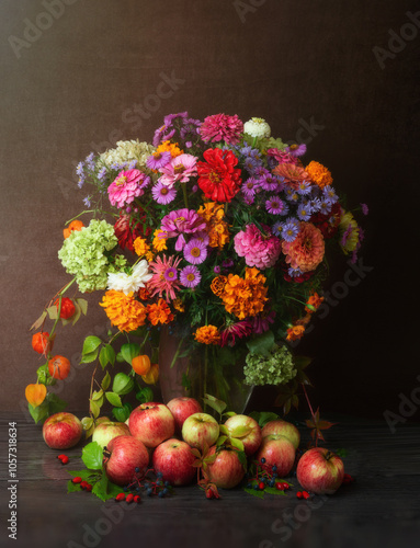 Wallpaper Mural Autumn concept. A bouquet of beautiful flowers of chrysanthemums, daisies and marigolds in a vase.  Apples in colorful leaves on a dark background. Harvest. Autumn still life. Torontodigital.ca