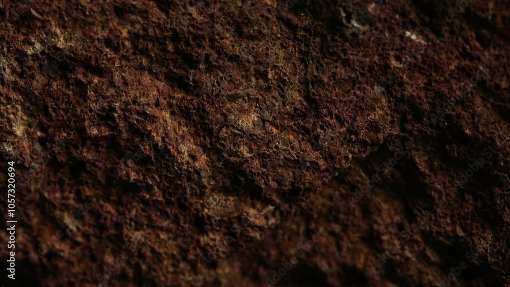 Close-up of rough brown rock texture. Close-up of rough brown rock texture.