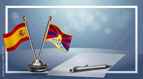 Spain and Tibet Small national flag on bokeh background, cooperative relationship