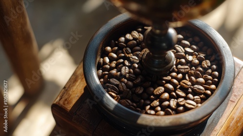 A close-up of coffee beans being ground in a vintage grinder,