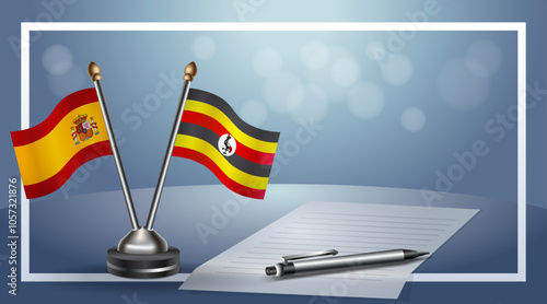 Spain and Uganda Small national flag on bokeh background, cooperative relationship