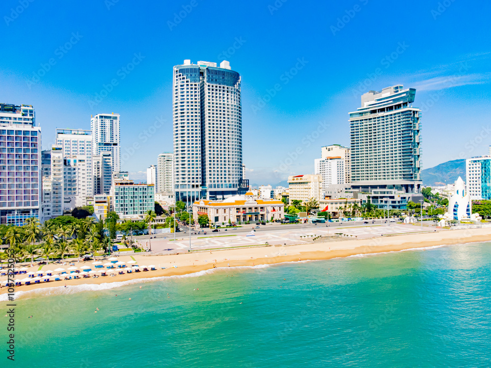 The sea promenade of the city.
Nha Trang is a resort city in Vietnam. It's a sunny day. Shooting from a drone. The sea promenade of the city.
Nha Trang is a resort city in Vietnam. It's a sunny day. Shooting from a drone.