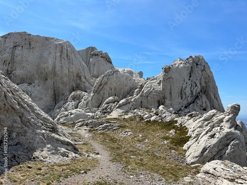 Rocky ridge of Tulove grede or karst mountain peak of Tulovice - Velebit Nature Park, Croatia (Stjenoviti greben Tulove grede ili krški planinski vrh Tulovice - Park prirode Velebit, Hrvatska) photo