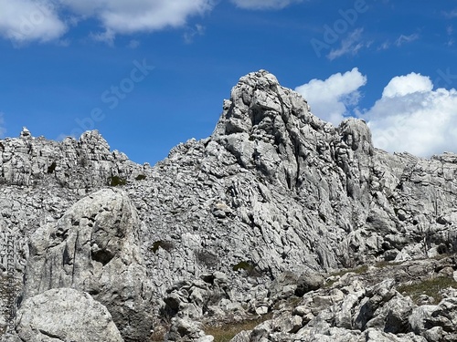 Rocky ridge of Tulove grede or karst mountain peak of Tulovice - Velebit Nature Park, Croatia (Stjenoviti greben Tulove grede ili krški planinski vrh Tulovice - Park prirode Velebit, Hrvatska)