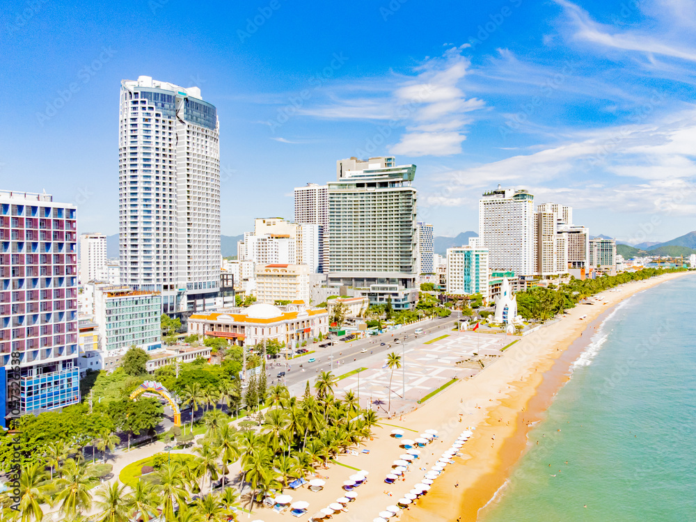 Obraz premium The sea promenade of the city.Nha Trang is a resort city in Vietnam. It's a sunny day. Shooting from a drone.