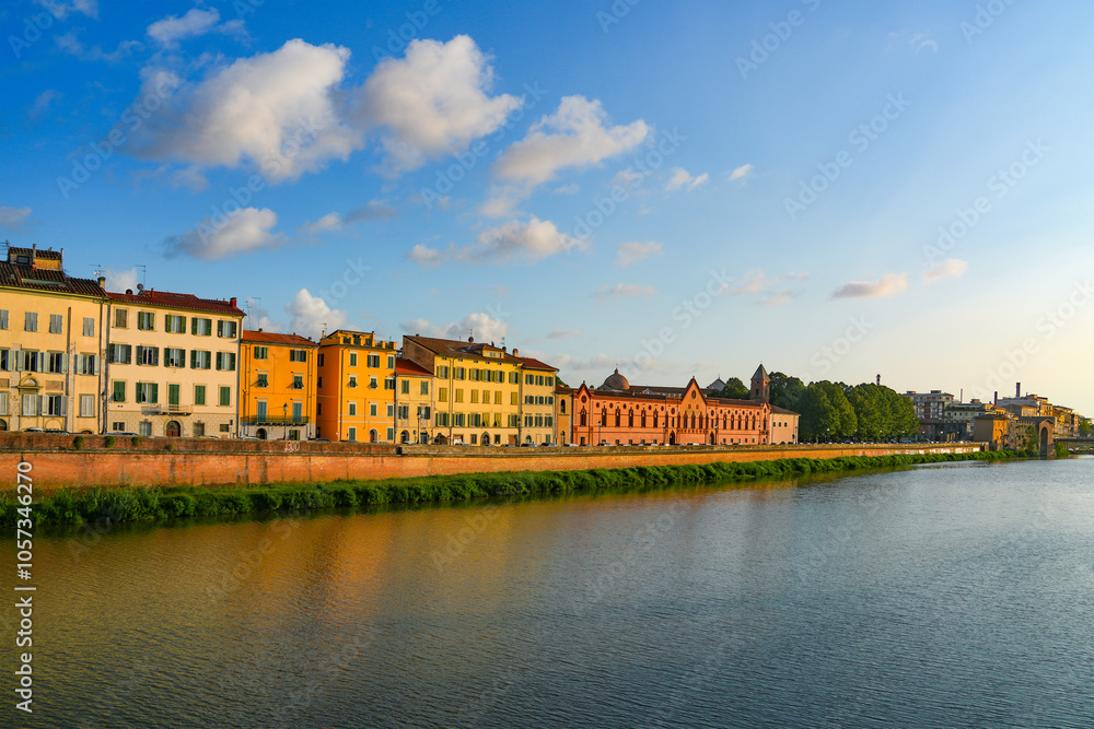 Naklejka premium Summer sunset landscape of Pisa old city and the embankment of Arno river, Italy, Europe