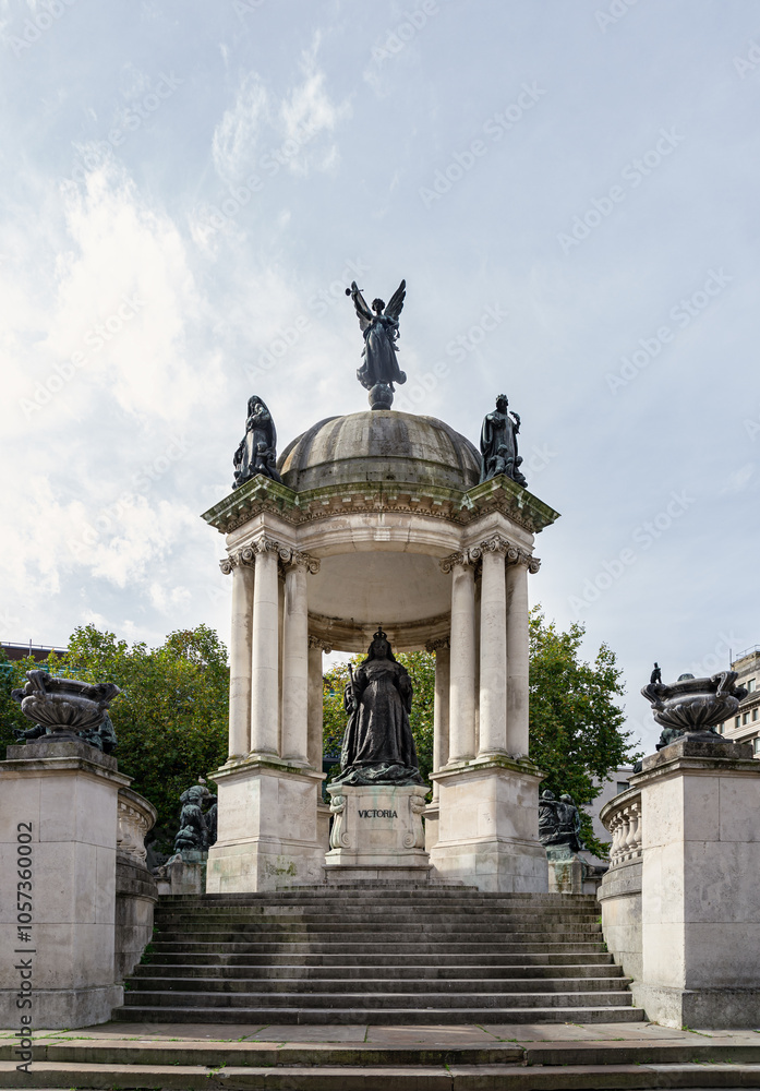 Statue of Queen Victoria monument at Derby square dominated (Beaux-Arts style memorial) in city center of Liverpool, Merseyside, Space for text, Selective focus. Statue of Queen Victoria monument at Derby square dominated (Beaux-Arts style memorial) in city center of Liverpool, Merseyside, Space for text, Selective focus.