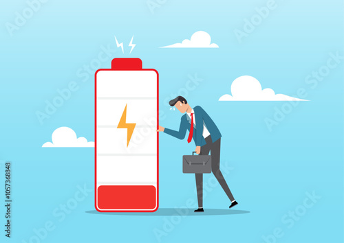 Fatigue and tired businessman stand with low battery sign