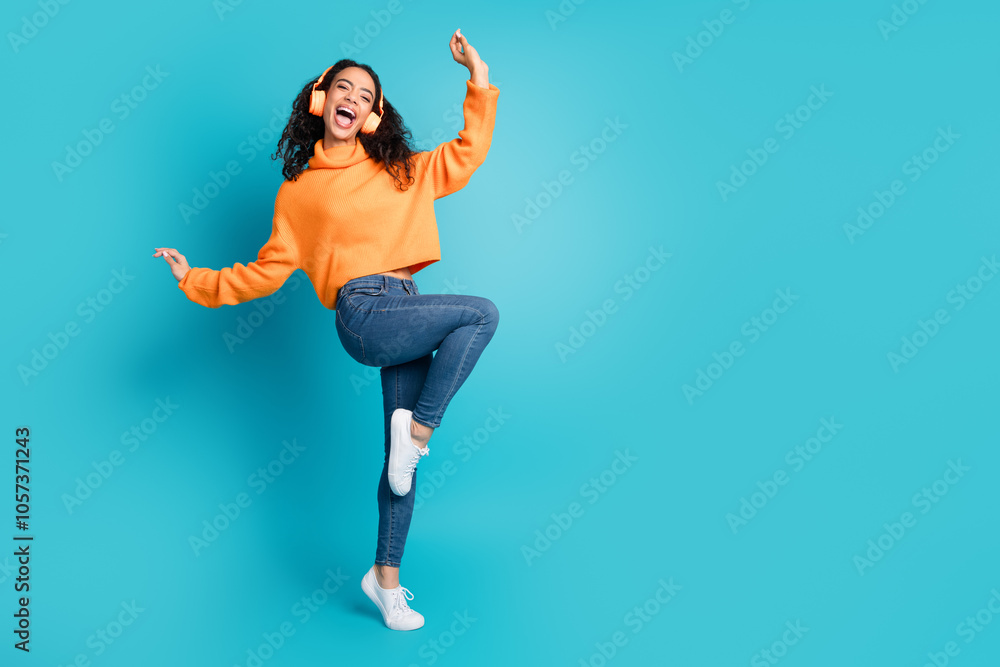Obraz premium Full body portrait of nice young girl dance headphones empty space isolated on turquoise color background