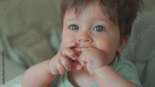 Baby boy eating at home