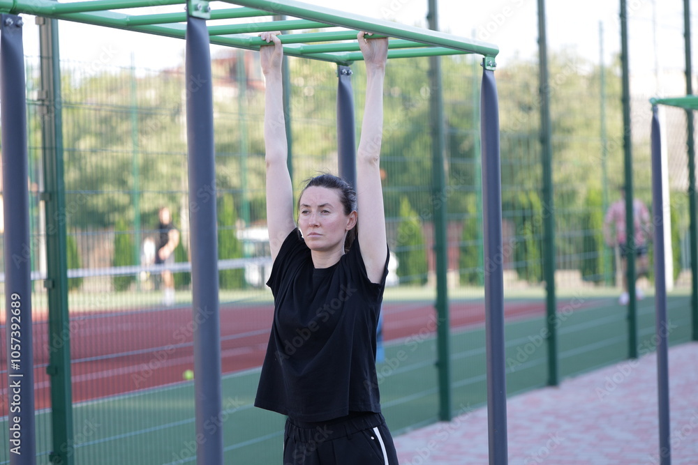 Fototapeta premium Woman doing workout exercises outside