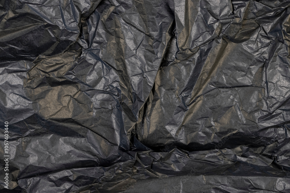 a piece of black soft paper for packaging goods and objects a piece of black soft paper for packaging goods and objects
