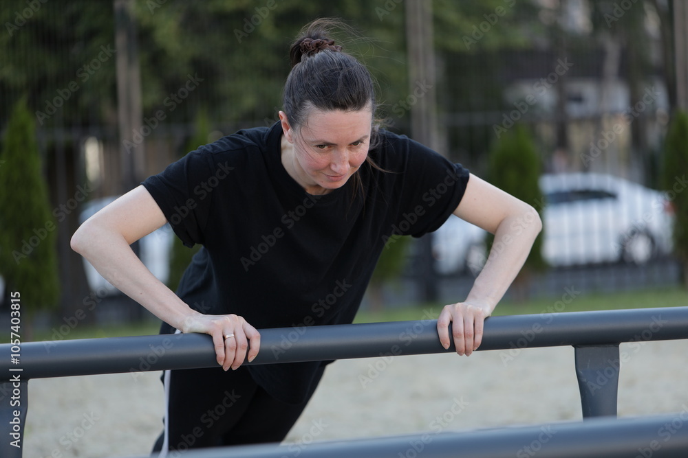 Fototapeta premium Woman doing workout exercises outside