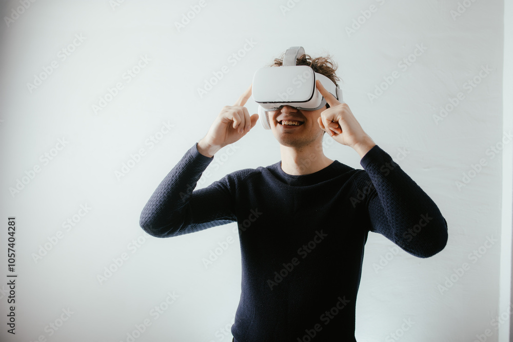 Young man exploring virtual reality with VR headset Young man exploring virtual reality with VR headset