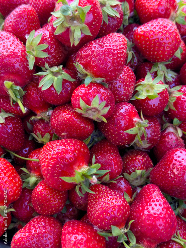 Bright and juicy fresh strawberries, a close-up of ripe berries with a rich red color.