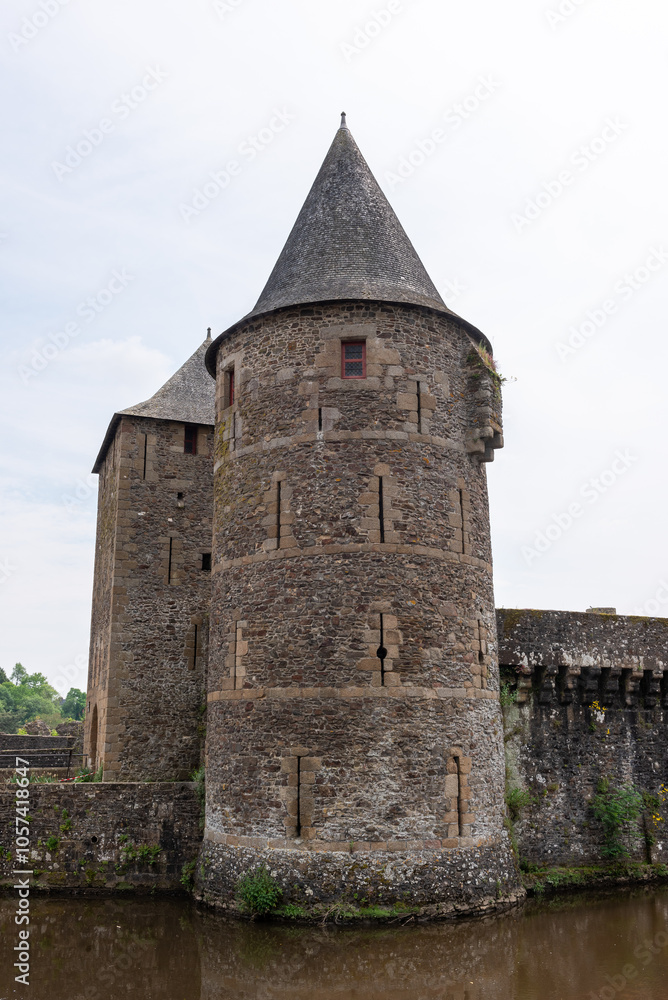 The Guemadeuc tower of the Fougeres medieval castle with the Le Nançon river in foreground (Fougeres, Ille-et-Vilaine, Bretagne, France) The Guemadeuc tower of the Fougeres medieval castle with the Le Nançon river in foreground (Fougeres, Ille-et-Vilaine, Bretagne, France)