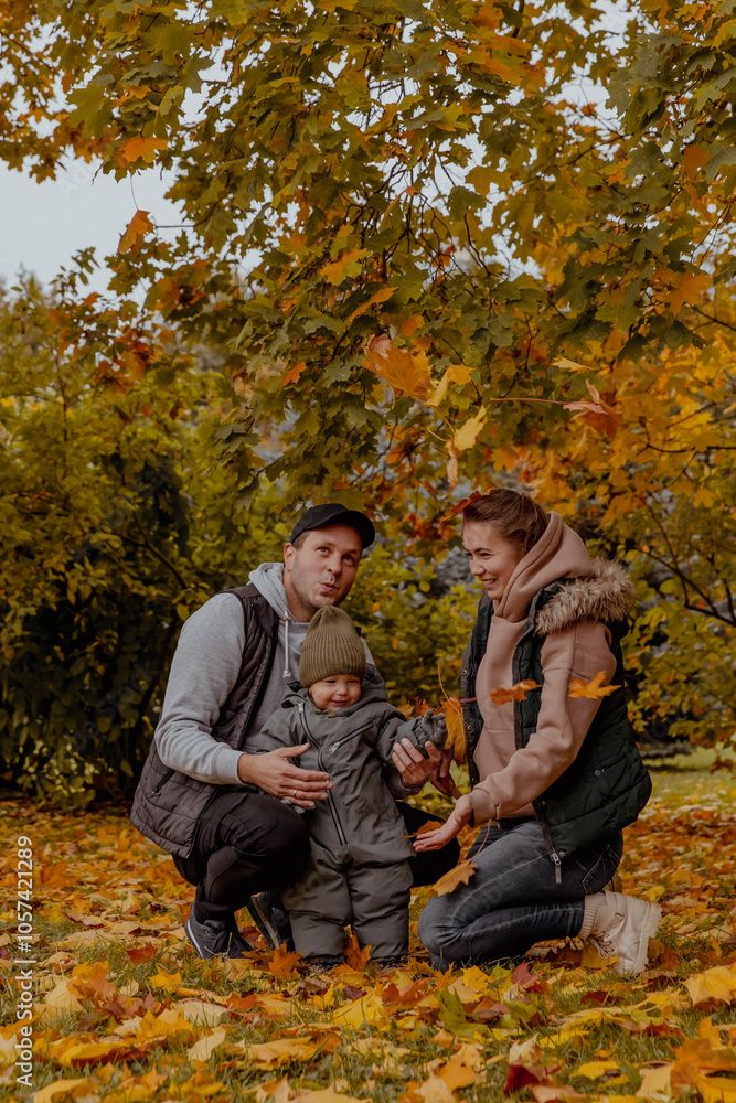 Family in nature in an autumn park with a child Family in nature in an autumn park with a child