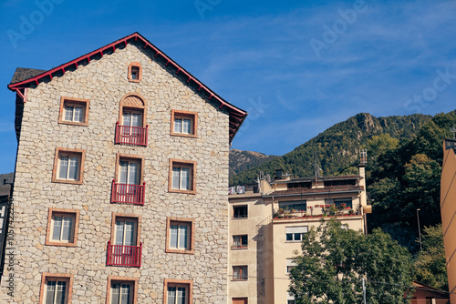 Historic stone buildings in Andorra under a clear blue sky during the day