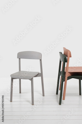 three modern design chairs with backrest in apartment interior