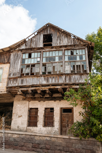 Abandoned brick building with broken windows and weathered facade