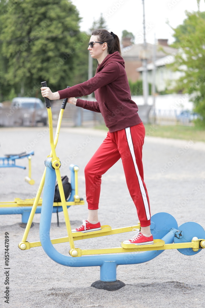 Fototapeta premium Woman exercising or doing workout session outside