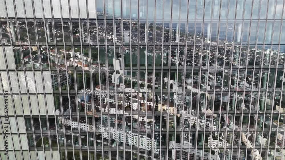 Drone view of city reflection in skyscraper glass Drone view of city reflection in skyscraper glass