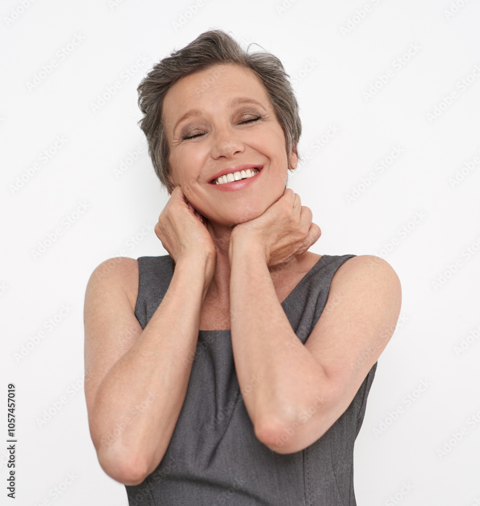Fototapeta premium Pride, winning and success with businesswoman in studio isolated on white background for celebration. Face, eyes closed or goals with happy worker with joy or smile for target, achievement or victory