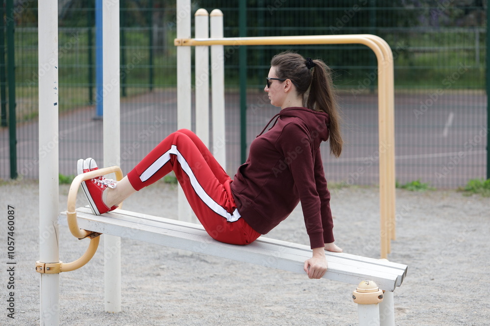 Fototapeta premium Woman exercising or doing workout session outside