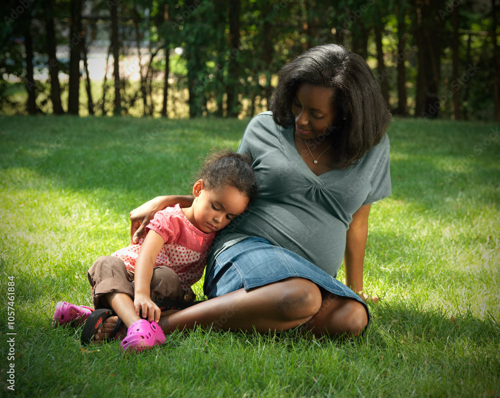 Mother and Daughter Sitting in Yard Mother and Daughter Sitting in Yard
