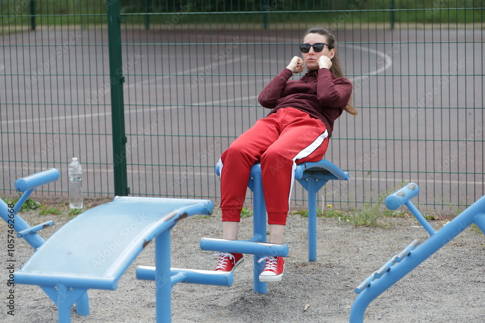 Fototapeta premium Woman exercising or doing workout session outside 